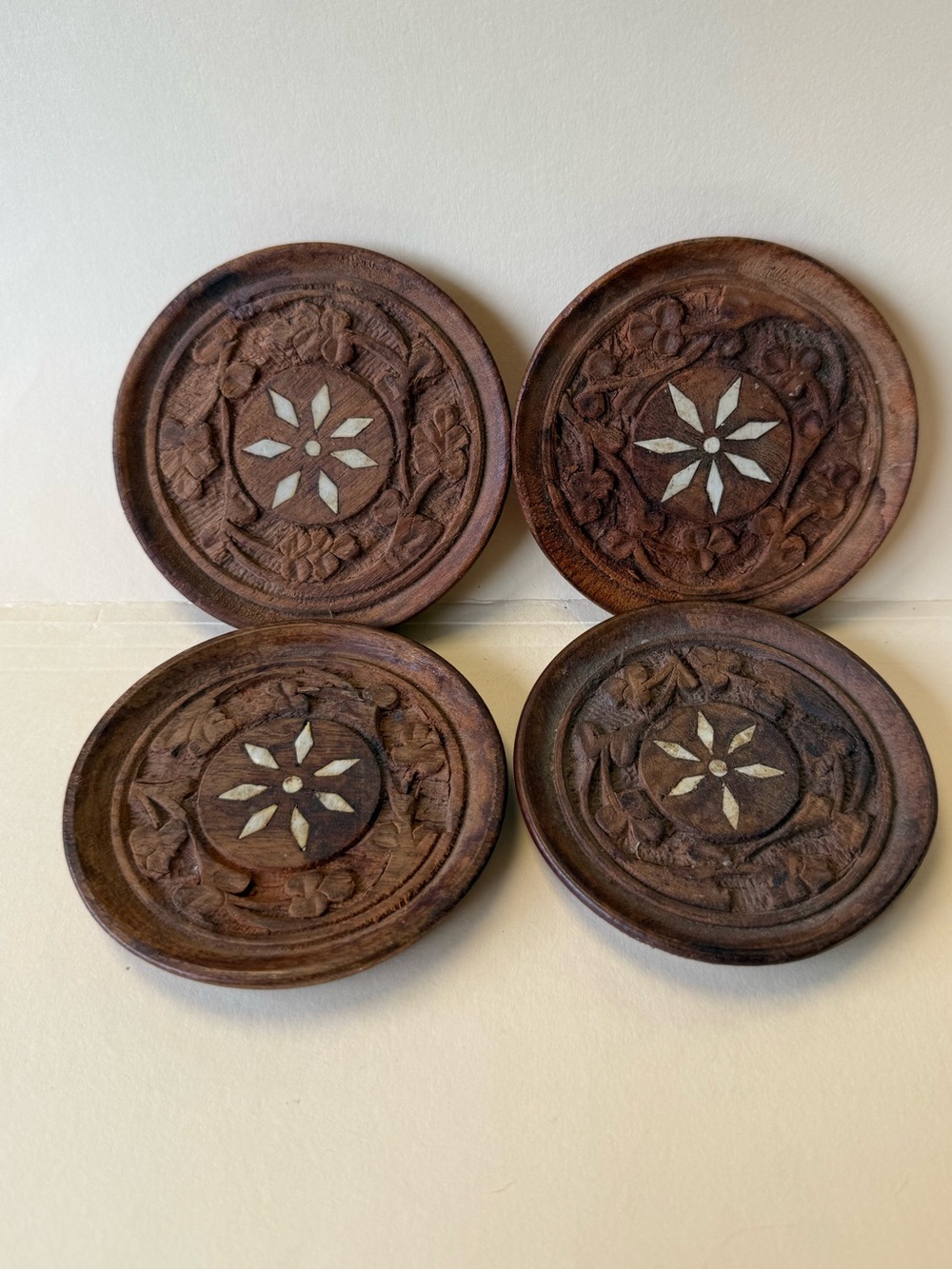 Set Of 4 Vintage Hand Carved Round Wood Coasters With Floral Shell Inlay India.